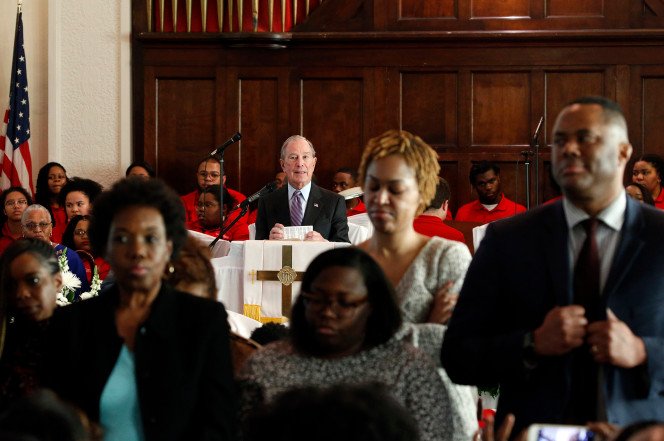 Congregants turn their backs on Bloomberg as he speaks at Alabama church